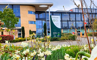 Parkside office with flowers in the foreground